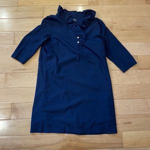 Navy ruffle neck dress. Great transitional piece. Super flattering.